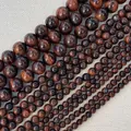 Makroaufnahme von roten Tigerauge-Rundperlen mit faseriger Textur und glänzendem Finish - Rotes Tigerauge 4mm