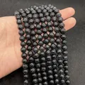 Detailed view of 8mm black turquoise beads with white spiderweb veins for DIY jewelry - Black Line Howlite / 6mm