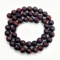 Macro shot of 8mm red tiger eye beads with natural polished luster for DIY jewelry making - Small Style / Red