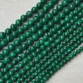 Natural malachite round beads in various sizes featuring unique green banded textures - Green / 6mm