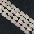 Strand of leaf-shaped rose quartz beads with natural pink hue and carved texture - White Jade