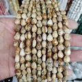 Water-drop shaped natural picture jasper beads with earthy brown and cream stone textures - Picture Jasper