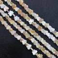 Natürliche Kleeblatt-Perlen aus Perlmutt in Weiß und Honiggold für DIY-Schmuck - Schmetterling 8x10mm