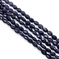 Deep blue goldstone oval faceted beads with shimmering galaxy effect for jewelry - Blue Sandstone