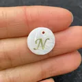 Round white shell charm with golden letter N for DIY necklace making projects - Letter N