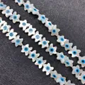 Star-shaped mother of pearl shell beads with blue evil eye design for jewelry making - Starfish Shape / 10mm