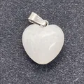 Polished opalite heart pendant with silver metal bail on a grey fiber background - 16x18mm / White Jade