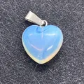 Light blue opal stone heart pendant with silver bail on textured black background - 16x18mm / Opal