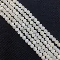 Macro shot of 2-6mm natural mother of pearl round beads for DIY jewelry making - White / 2mm