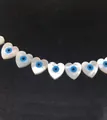 Natural heart shell beads with blue evil eye design for handmade DIY jewelry making - Horizontal Hole Heart Shape / 10mm