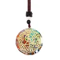 Macro view of Orgone pendant with colorful natural stones and gold metal filigree - Seven Chakras Golden Symbol Style (3-10)