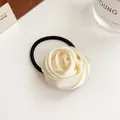 Cream satin rose flower hair scrunchie with elastic band on a minimalist background - Off White
