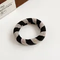 Elastic checkerboard knit hair scrunchie with black and cream spiral texture - Twisted Texture