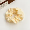 Pale yellow ruffled fabric scrunchie in cloud-like shape for minimalist ponytail style - Yellow