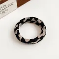 Elastic knitted scrunchie with checkerboard zebra pattern in beige and black - Leopard Print
