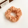 Chic apricot orange bubble fabric scrunchie with soft pleated texture for ponytails - Orange