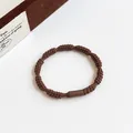 Elastic brown lotus root knot hair tie with textured spiral design and high stretch - Brown