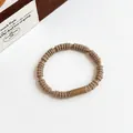 Elastic braided hair tie in coffee brown with a sleek matching cylindrical connector - Khaki