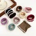 Elastic pearl hair ties set in various colors like black, beige, and pink for women - Random Mixed