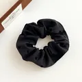 Black large scrunchie with subtle heart patterns and textured fabric for ponytails - Black Heart