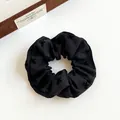 Elegant black scrunchie with embroidered texture and high-elasticity fabric - Black Bow