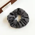 Gray fabric scrunchie with black embroidered bow patterns and elastic stretch band - Gray with Bowknot