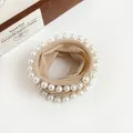 Elegant beige high elasticity hair scrunchie with white pearl trim for buns and ponytails - Nude