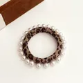 Elegant leopard print scrunchie with white pearl trim for high ponytail hairstyles - Leopard Print