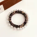 Tiger print hair scrunchie with white pearl embellishments for hair styling - Black Stripe