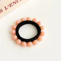 Elastisch zwart haarelastiekje met roze harskralen in minimalistische Koreaanse stijl - Oranjeroze