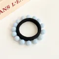 Elastische zwarte haarelastiek met veertien lichtblauwe kralen in een naadloos ontwerp - Blauw
