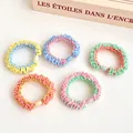 Five macaron scrunchies with plastic beads in pastel colors for high ponytail hairstyles - Random Mixed