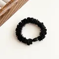 Elegant black pleated hair scrunchie with a polished black oval bead detail - Black