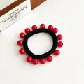Elastisch zwart haarelastiekje versierd met glanzende helderrode bolvormige kralen - Rood