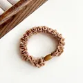 Coffee brown ruffle hair scrunchie with a decorative oval bead for ponytail styling - Light Coffee
