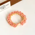 Elastic candy-colored hair scrunchie in pink and yellow with decorative bead - Orange