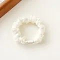 White organza scrunchie with glittery floral prints and a durable plastic connector - Off White