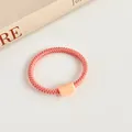 Elastic macaron hair tie in coral pink with matching matte decorative buckle - Bud Pink