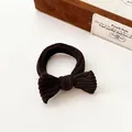 Dark brown bow hair tie in corduroy texture with high elasticity on beige background - Dark Brown