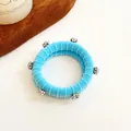 Chouchou bleu ciel côtelé orné de strass brillants pour une queue de cheval élégante - Bleu