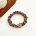 Brown scrunchie with heart-shaped charm and rhinestones in high-stretch fabric - Heart-Light Coffee