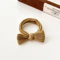 Brown corduroy bow hair tie with high elastic band and textured fabric finish - Turmeric