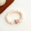 Cream-colored scrunchie with a brown heart-shaped ornament and amber rhinestones - Heart-Beige