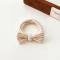 Cream bow hair scrunchie with ribbed fabric texture and high elastic durable band - Beige