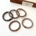 Set of 5 durable coffee-toned braided hair ties with smooth resin connectors - Multicolor