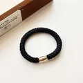 Coletero elástico tejido negro con cuenta decorativa ovalada de metal en oro rosa - Negro