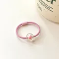Elastic pink hair tie for kids featuring a cute transparent candy bead with a pink core - Pink