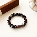 Brown elastic hair tie with colorful bead embellishments and resin buckle detail - Dark Brown