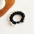 Elastico per capelli a pois con bordo a balze bianche e ciondolo a sfera nero decorativo - Nero