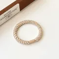 Beige woven hair tie with silver threads and durable mocha plastic clasp connector - Beige